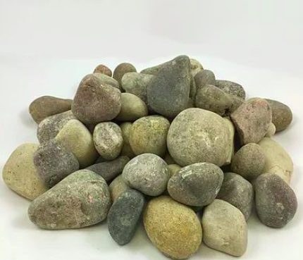 A pile of Oak Creek Plum, large rounded stones in muted plum, olive and grey
