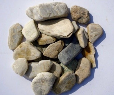 Alaska Glacier rock, smooth pale stones in cool white, blue-grey and soft gold