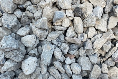 Crushed recycled concrete, pale grey angular chunks with the odd darker piece